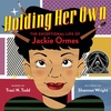 "Holding Her Own: The Exceptional Life of Jackie Ormes" by Traci N. Todd; illustrated by Shannon Wright shows cartoonist Jackie with an artist's pencil and paint brushes poking through her hair.