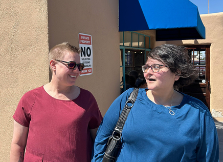 Emily with Margaret Neill of Santa Fe Public Library outside The Panty cafe. 