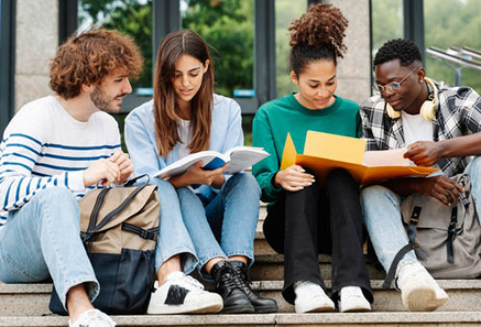 College students talking on staircase