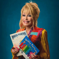 Dolly Parton holding two books