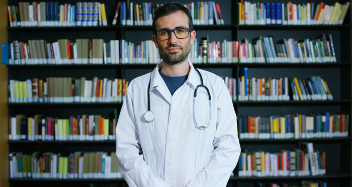 A doctor in a medical library