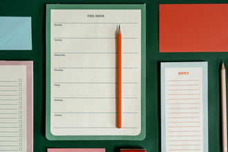 Various colorful notepads with checklists on them