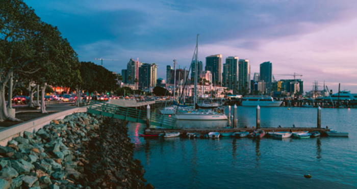 View of San Diego from the bay with a sailboat in the foreground