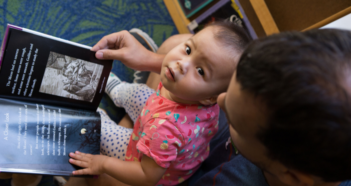 Papa reads to baby in Lakeland, OH